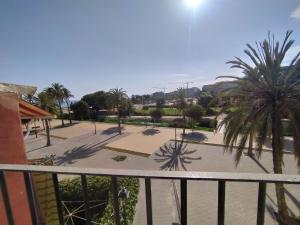 a view from a balcony of a park with palm trees at Holiday Home Casa Sea Colors by Interhome in Villajoyosa