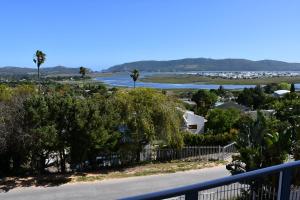 a view of a river from a balcony at Friendz Guesthouse in Knysna