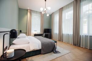 Postel nebo postele na pokoji v ubytování Alice Hotel
