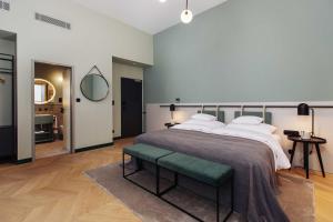 Postel nebo postele na pokoji v ubytování Alice Hotel