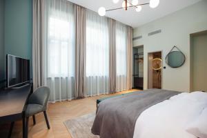 Postel nebo postele na pokoji v ubytování Alice Hotel