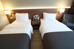 En eller flere senger på et rom på Holiday Inn Bursa - City Centre, an IHG Hotel