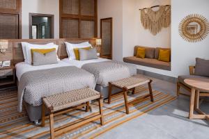 A bed or beds in a room at Steigenberger Resort Ras Soma