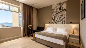 Krevet ili kreveti u jedinici u okviru objekta Cornaro Hotel