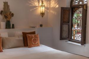 Postel nebo postele na pokoji v ubytování Riad Babouchta & Spa