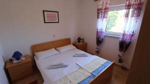 Postel nebo postele na pokoji v ubytování Apartments Damir