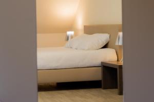 Postelja oz. postelje v sobi nastanitve Hotel Soret
