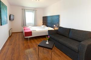 Postel nebo postele na pokoji v ubytování Rasta Håby