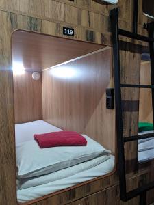 
Кровать или кровати в номере Капсульный отель на Белорусской
