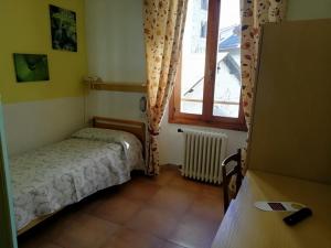 Posteľ alebo postele v izbe v ubytovaní Hotel Gufo
