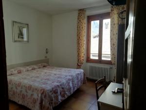 Posteľ alebo postele v izbe v ubytovaní Hotel Gufo