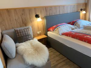 Łóżko lub łóżka w pokoju w obiekcie Pension & Apartments Waldkrieber