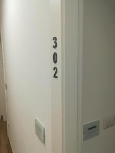 a door with the number thirty two on it at Hotel Flora in Alba Adriatica
