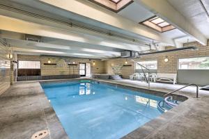 a large swimming pool in a building at Modern Condo 2 Blocks to Main Street Frisco! in Frisco