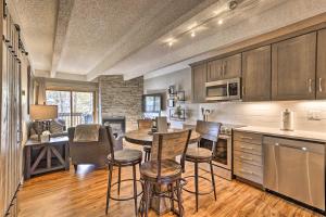 a kitchen with a table and chairs in a room at Modern Condo 2 Blocks to Main Street Frisco! in Frisco