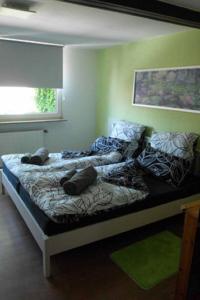 Postel nebo postele na pokoji v ubytování Ferienwohnungen Federleicht