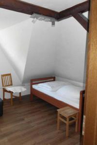 Ein Bett oder Betten in einem Zimmer der Unterkunft Ferienwohnungen Federleicht