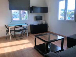 TV a/nebo společenská místnost v ubytování Apartamentos Ronda Luz