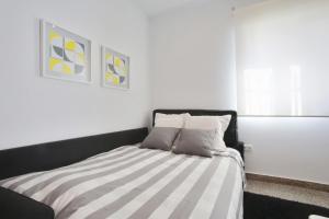 Postel nebo postele na pokoji v ubytování Apartamentos Ronda Luz