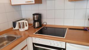 a kitchen with a sink and a counter top at Ferienwohnung für 5 Personen in Wasserburg in Wasserburg