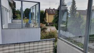 a view of a house from the outside of a window at Ferienwohnung für 5 Personen in Wasserburg in Wasserburg am Bodensee