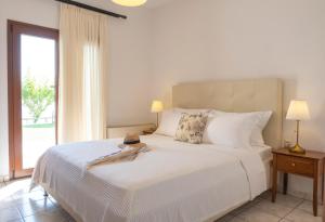 A bed or beds in a room at Aegean Blue Horizon