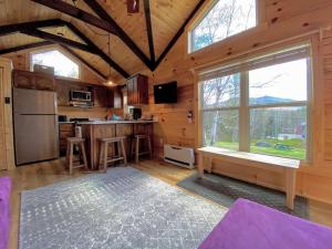 a kitchen with a large window in a cabin at B10 NEW Awesome Tiny Home with AC Mountain Views Minutes to Skiing Hiking Attractions in Carroll