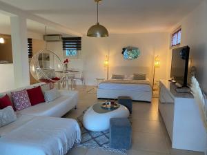 a large living room with a couch and a bed at Villa W in Cassis