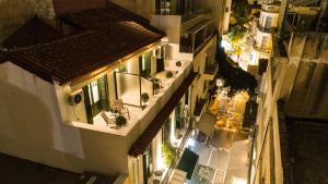 an overhead view of a city at night at Pandrosos Divine Suites in Athens