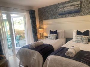 Ένα ή περισσότερα κρεβάτια σε δωμάτιο στο Toppesfield House B&B