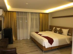 Postel nebo postele na pokoji v ubytování Kin Bed Chiang Mai