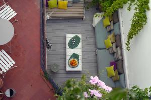an overhead view of a table and chairs on a deck at La Casita del Mar in Sitges