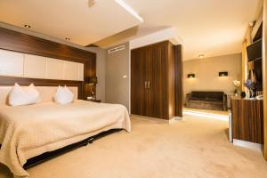 Voodi või voodid majutusasutuse Duna Garden Hotel toas