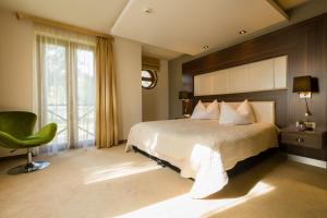 Voodi või voodid majutusasutuse Duna Garden Hotel toas