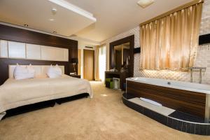 Voodi või voodid majutusasutuse Duna Garden Hotel toas