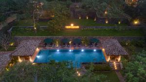 an aerial view of a swimming pool at night at Green Escape Unawatuna in Unawatuna