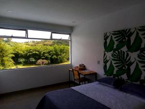 Postel nebo postele na pokoji v ubytování Hotel HACIENDA SAN AGUSTIN