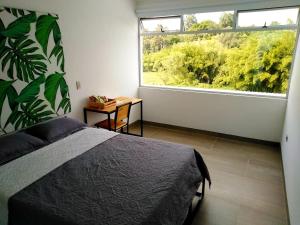 Postel nebo postele na pokoji v ubytování Hotel HACIENDA SAN AGUSTIN