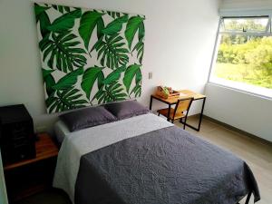 Postel nebo postele na pokoji v ubytování Hotel HACIENDA SAN AGUSTIN