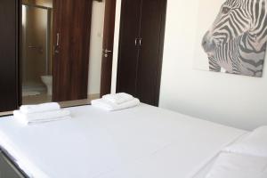 Postel nebo postele na pokoji v ubytování Palm Tree Villas