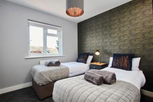 Кровать или кровати в номере Meadow Cott