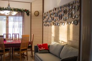 a living room with a couch and a table at Lake Suite Family in Lahti +52 photos