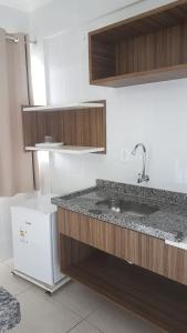 a kitchen with a sink and a counter top at Lacqua Diroma Caldas Novas PB Turismo in Caldas Novas