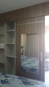 a bedroom with a canopy bed with a glass door at Lacqua Diroma Caldas Novas PB Turismo in Caldas Novas