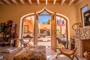a living room with an open door to a patio at Oasis in San Miguel in San Miguel de Allende