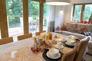 a dining room with a table with food on it at Thatchcombe B&B in Wantage