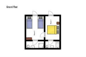 a floor plan of a house with furniture at Chalet les Vieux Murs in L'Alpe-d'Huez