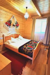 Säng eller sängar i ett rum på Cabanele FloriCrin - Cabana Mare