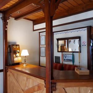 a room with a desk and a mirror at Ushuaia Lodge Las Margaritas 430 in Ushuaia