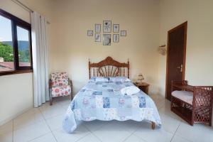 Cama ou camas em um quarto em Pousada Aconchego